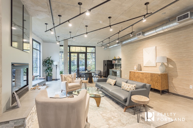 Streetcar Lofts resident lounge with modern furniture and fireplace